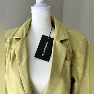 Woman's green blazer dress